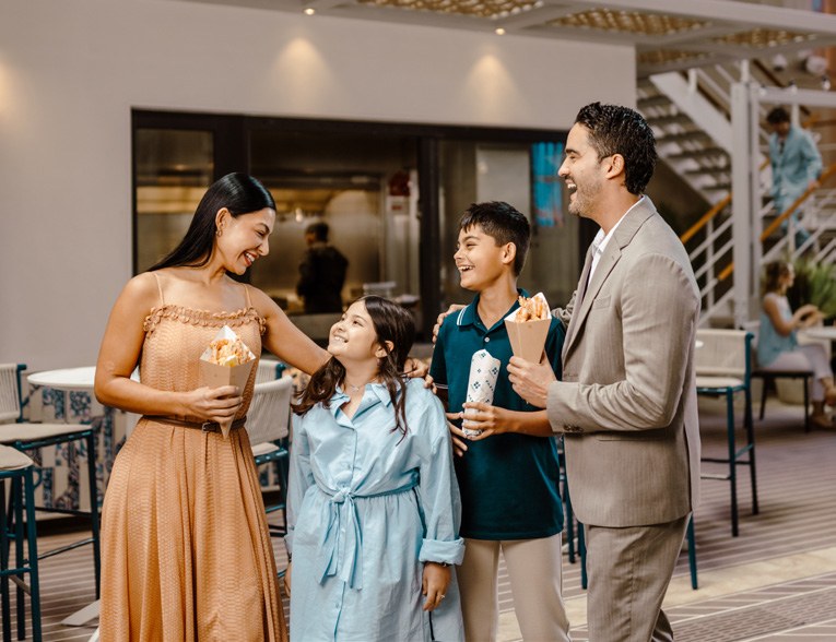 Family enjoying treats aboard MSC World America